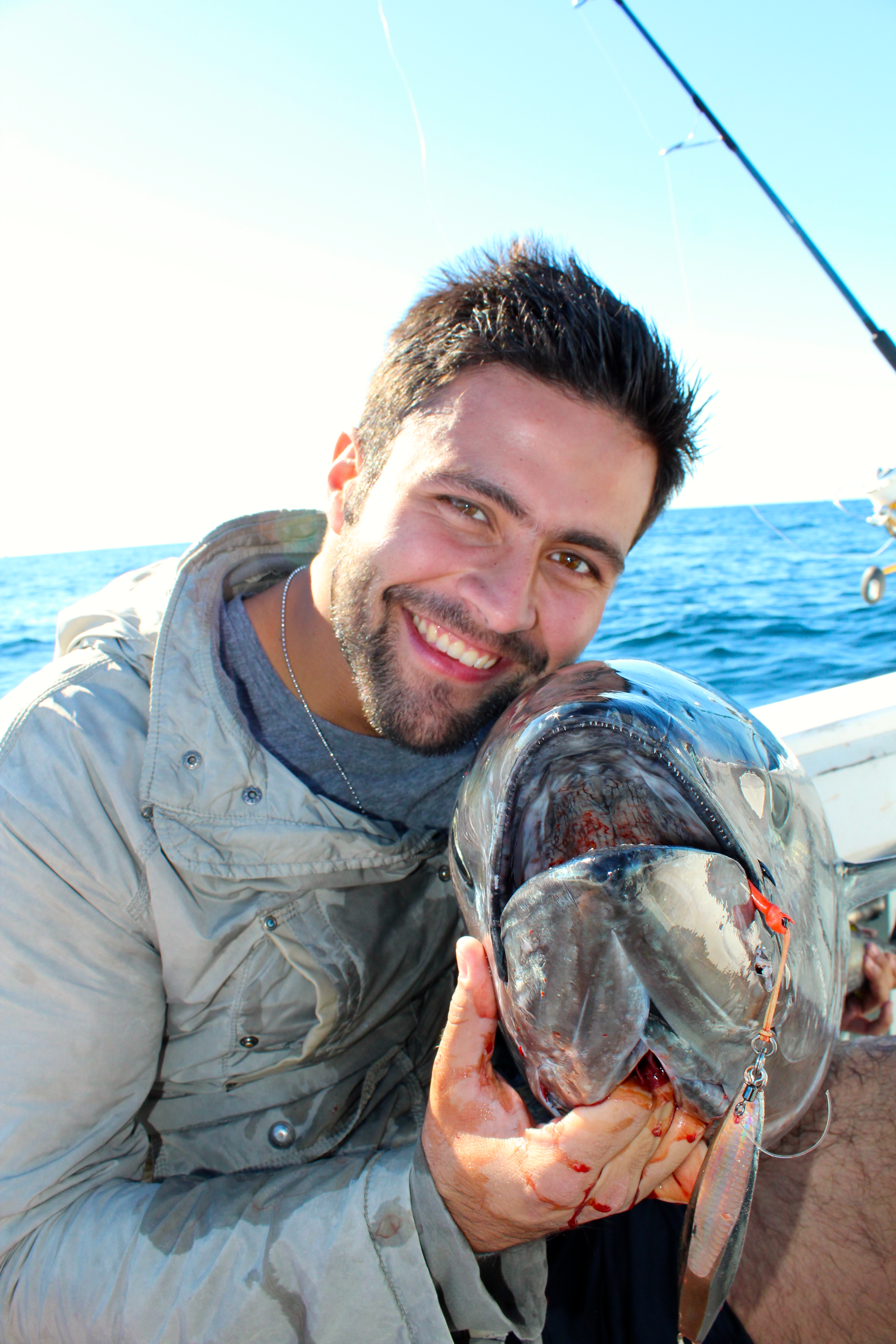 The results...a happy angler after landing a bluefin on a jig aboard Coastal Charters Sportfishing.