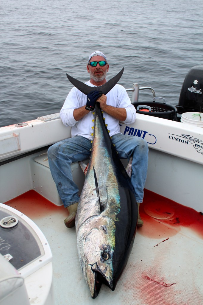Angler Mike Leonard with a stud bluefin caught aboard Coastal Charters Sportfishing.